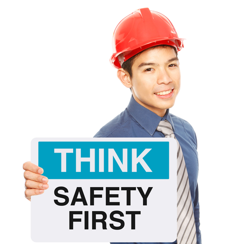 young worker with sign, Safety First © Arnel Manalang | Dreamstime.com